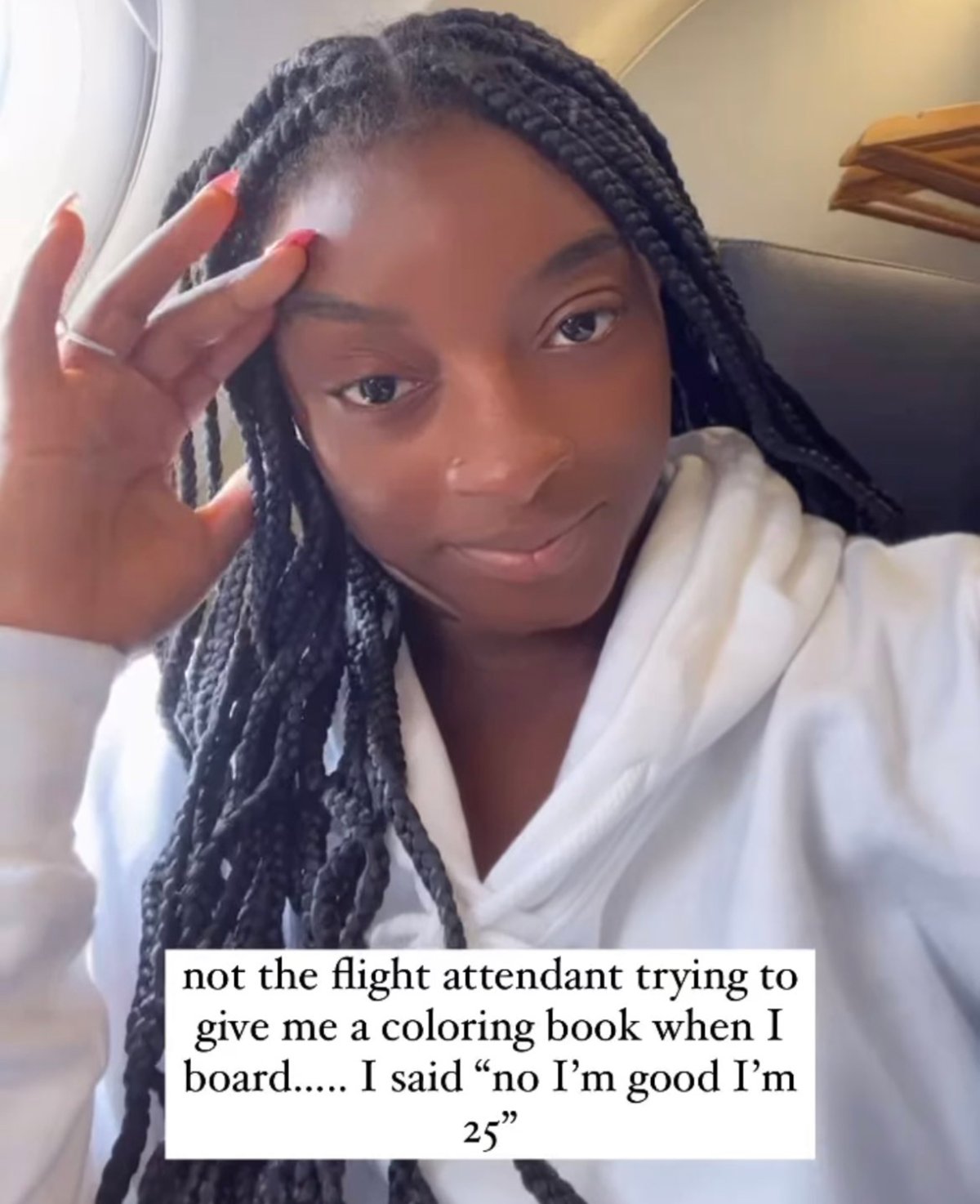 Simone Biles with a look of disbelief on her face after a flight attendant offered her a colouring book on a recent flight.