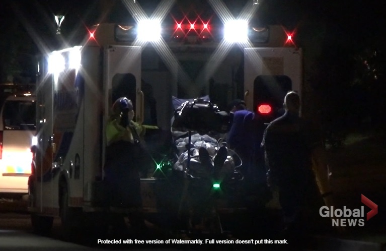 Paramedics load a person into an ambulance following a reported multiple stabbings at an Omemee apartment on July 2, 2022.