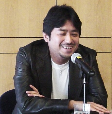 Takahashi Kazuki speaking at a panel.