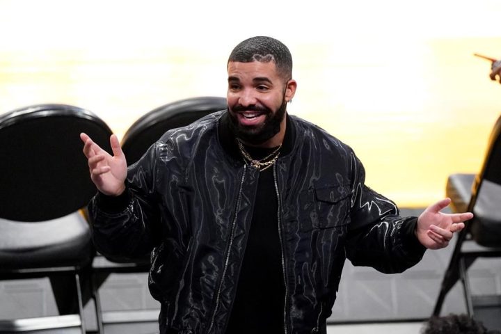 Rapper Drake gestures after watching an NBA basketball Western Conference Play-In game between the Los Angeles Lakers and the Golden State Warriors Wednesday, May 19, 2021, in Los Angeles. Drake says he's tested positive for COVID-19 and the Young Money Reunion planned for Budweiser Stage today in Toronto will be postponed. THE CANADIAN PRESS/AP/Mark J. Terrill.