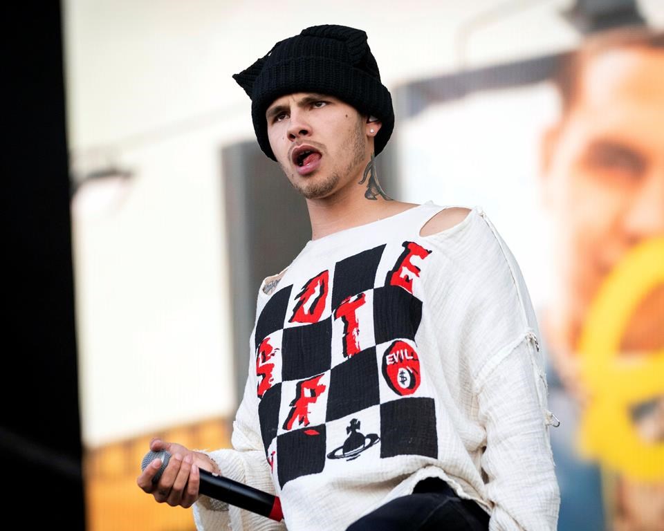 Slowthai performs at the Reading Music Festival, England, Saturday, Aug. 28, 2021. Organizers at Montreal's Osheaga music festival are apologizing after a British rapper performed while dressed in a T-shirt emblazoned with a swastika.