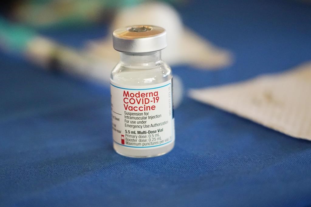 A vial of the Moderna COVID-19 vaccine rests on a table at an inoculation station next to Jackson State University in Jackson, Miss., Tuesday, July 19, 2022. (AP Photo/Rogelio V. Solis, File, File).