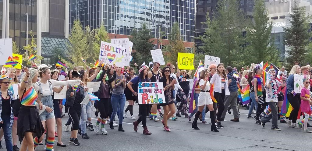 People take part in a recent Calgary Pride parade. Calgary Pride says this year's parade marshals will be LGBTQ refugees who now call the city home.
