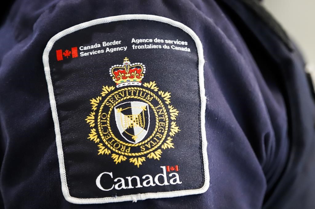 A Canada Border Services Agency (CBSA) patch is seen on an officer in Calgary, on Aug. 1, 2019.
