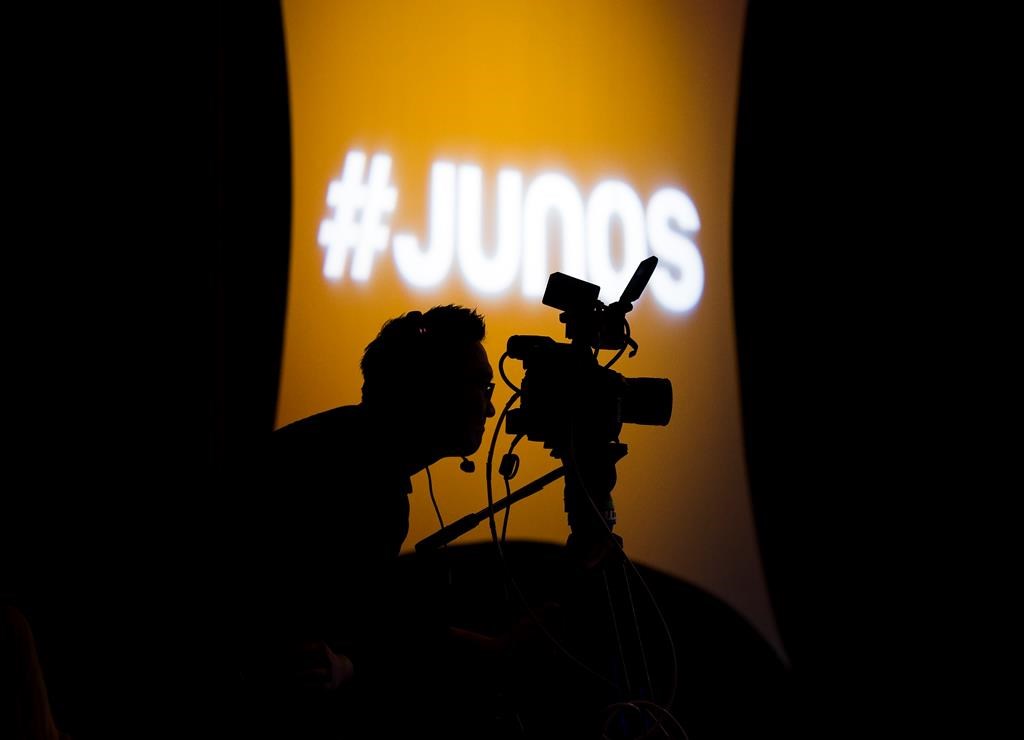 A videographer looks through his camera during the Juno Award nominee press conference in Toronto on Tuesday, January 28, 2020.