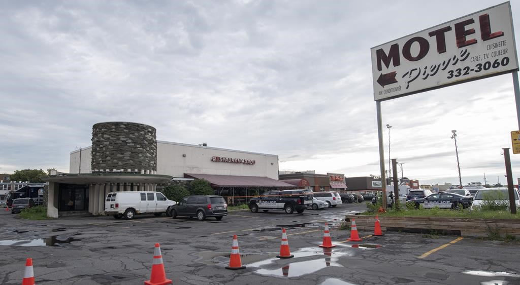 A suspect in three murders in the greater Montreal area who was killed by police Thursday represented a significant risk to public safety due to his mental state, according to a recent ruling by a mental health review board. The scene where a 26-year-old man was killed after being shot by Montreal police at a motel in Montreal's St-Laurent borough early Thursday, Aug. 4, 2022. 