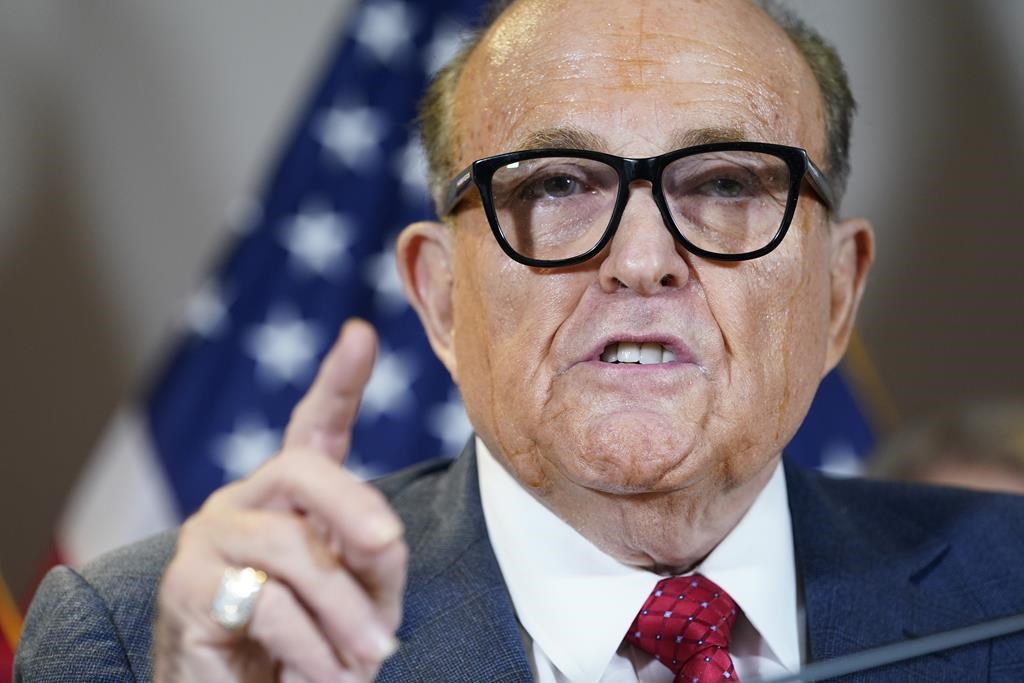 FILE - Former New York Mayor Rudy Giuliani, a lawyer for President Donald Trump, speaks during a news conference at the Republican National Committee headquarters, Nov. 19, 2020, in Washington. A lawyer for Giuliani says he will not appear as scheduled Tuesday, Aug. 9, 2022, before a special grand jury in Atlanta that's investigating whether former President Donald Trump and others illegally tried to interfere in the 2020 general election in Georgia. (AP Photo/Jacquelyn Martin, File).