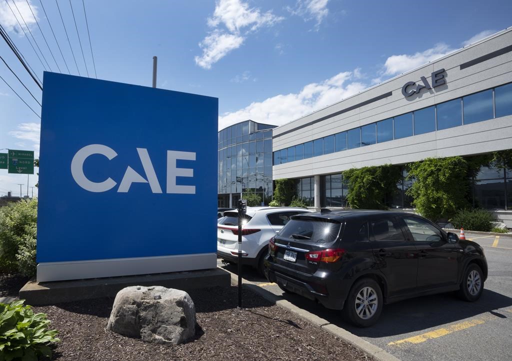 The new CAE logo is seen in front of the flight and simulation company’s plant, Thursday, July 21, 2022 in Montreal.
