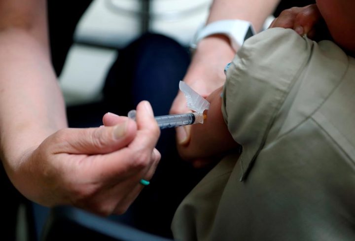 A registered nurse administers a vaccination to a young boy in Mount Vernon, Ohio on May 17, 2019. Some Ontario students are starting to receive suspension notices over out-of-date immunization records, but many health units are giving families more time to catch up.