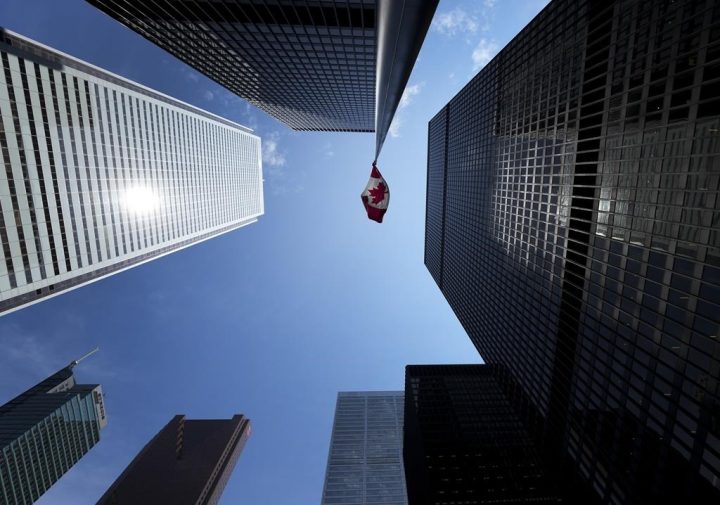 The Bay Street Financial District is shown with the Canadian flag in Toronto on Friday, August 5, 2022. 