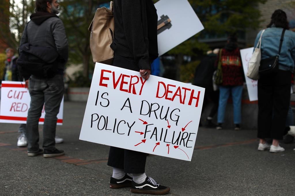 Moms Stop the Harm advocates and supporters gather at Centennial Square on the sixth anniversary of a public health emergency due to the opioid-related deaths across British Columbia, in Victoria on April 14, 2022. B.C. says it has suffered more than 10,000 overdose deaths since the province declared a public health emergency in April 2016. THE CANADIAN PRESS/Chad Hipolito.