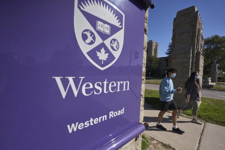 Students walk across campus at Western University in London, Ont., September 19, 2020. Concerns are being raised that Western University's decision to mandate COVID-19 boosters shortly before the fall semester may create barriers for marginalized students. TTHE CANADIAN PRESS/Geoff Robins.