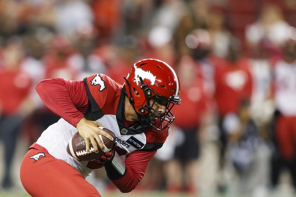 Calgary Stampeders quarterback Jake Maier (12) rushes with the ball during second half CFL football action against the Toronto Argonauts in Toronto on Saturday, August 20, 2022. The second-year quarterback will be Calgary's starter Thursday night when the Stampeders (6-3) visit the Winnipeg Blue Bombers (9-1).
