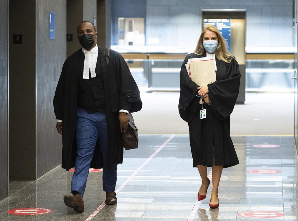 Annabelle Sheppard, right, Crown prosecutor for the case against Luc Wiseman, and Wiseman’s lawyer, Alexandre Bien-Aime, arrive at the courthouse in Montreal, on June 23, 2021.