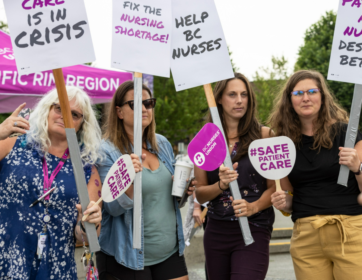 Nurses from Campbell River, B.C. and surrounding areas join members of the public in rallying to support nurses and raise awareness of increasing pressures on the B.C. health-care system, on Aug. 10, 2022.