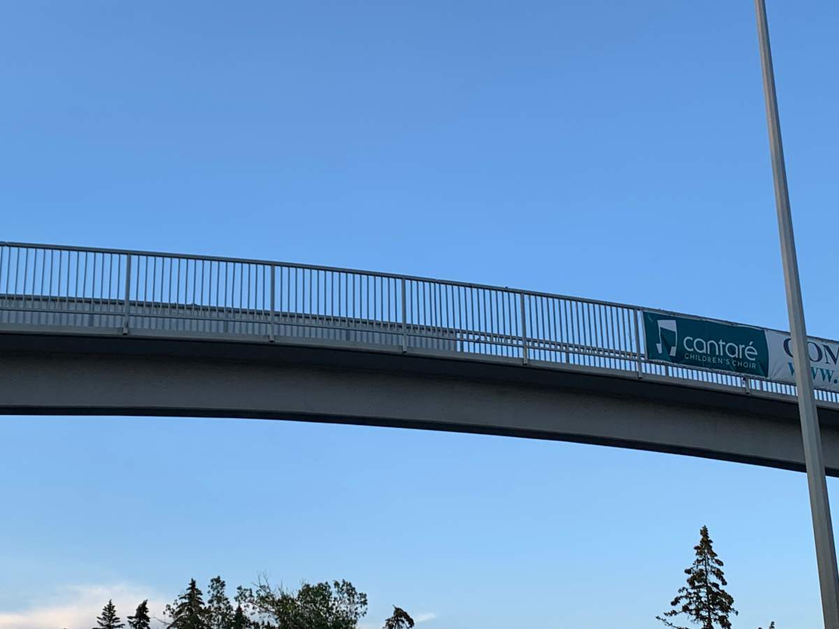 The Calgary pedestrian overpass crossing Macleod Trail, pictured on August 11, 2022, showing the white supremacist banner removed.
