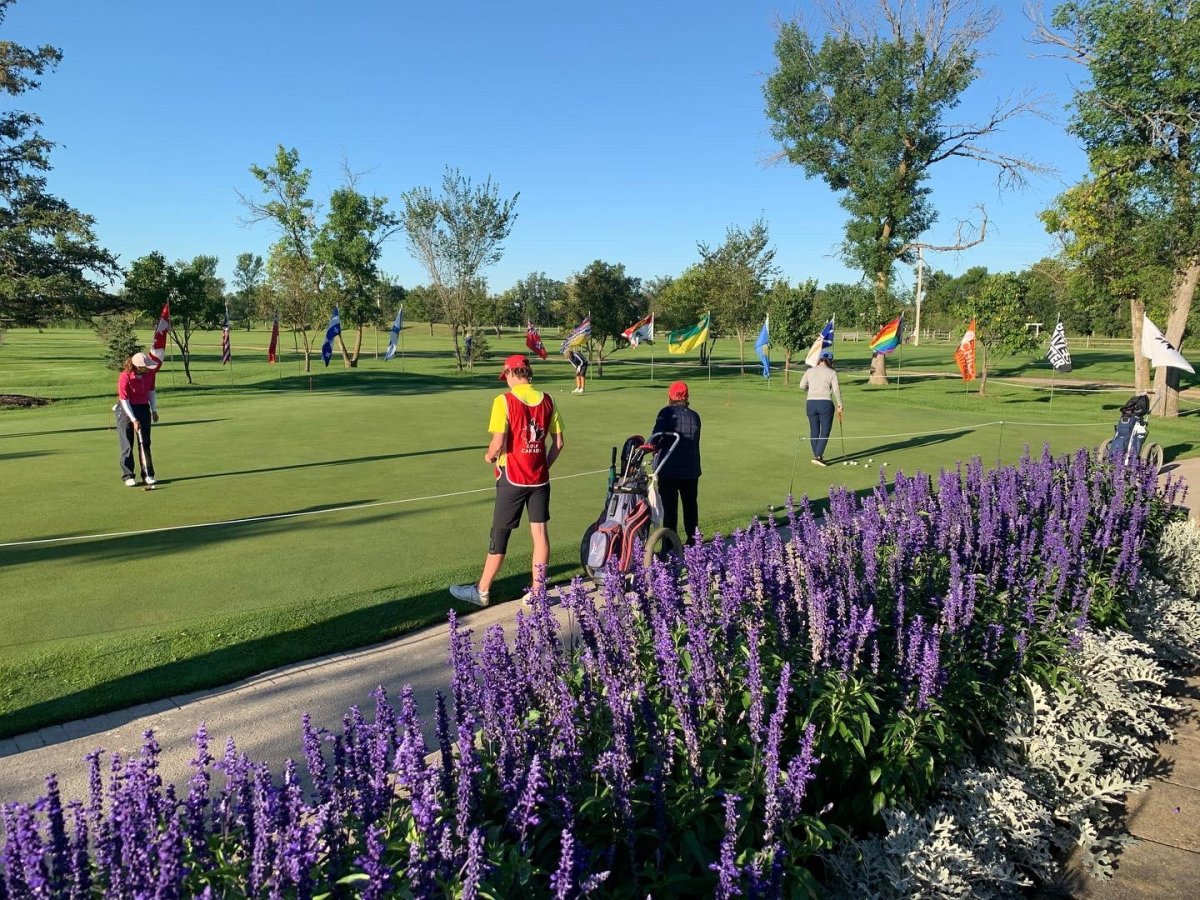 Competitors warm up for Round One of the Canadian Women's Mid-Amateur and Senior Championship Tournament at Breezy Bend .