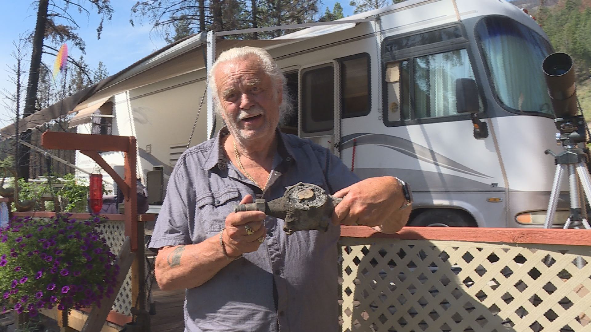 Killiney Beach seasonal resident Barry Gillrie shows his original water meter which was destroyed ina fire.