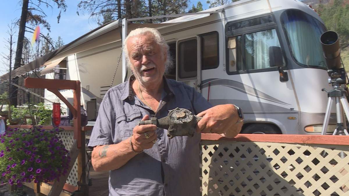 Killiney Beach seasonal resident Barry Gillrie shows his original water meter which was destroyed ina fire.