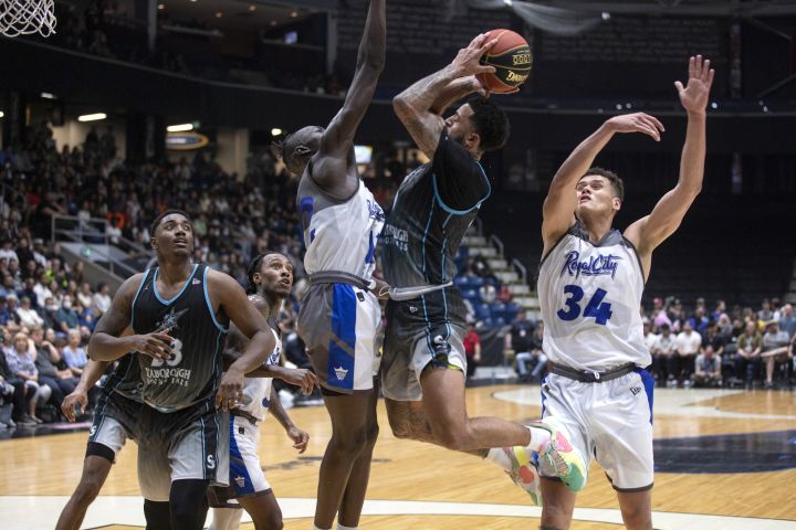 Scarborough Shooting Stars guard Jalen Harris (0) goes to the basket against Madut Akec (12) of the Guelph Nighthawks during second half CEBL action in Guelph, Ont., on Thursday, May 26, 2022. 