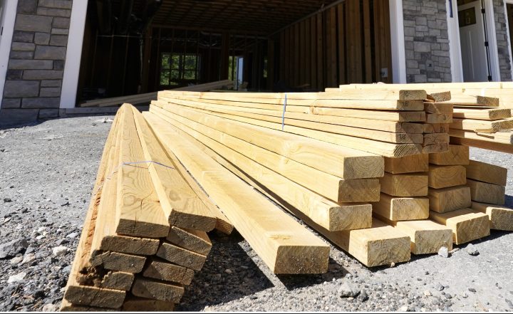 In this June 24, 2021 file photo, lumber is piled at a housing construction site in Middleton, Mass.   