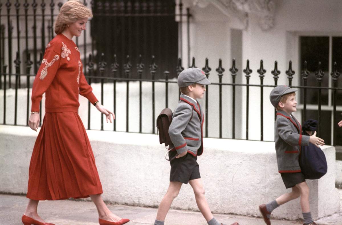 Diana, Princess of Wales, following her sons Prince Harry (right), then five years old, and Prince William, then seven, on Harry's first day at the Wetherby School in Notting Hill, West London.