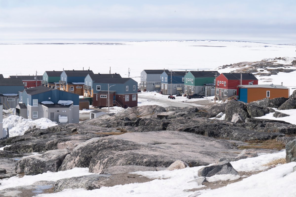 Homes face the Hudson Bay Thursday, May 12, 2022 in Inukjuak, Que. 