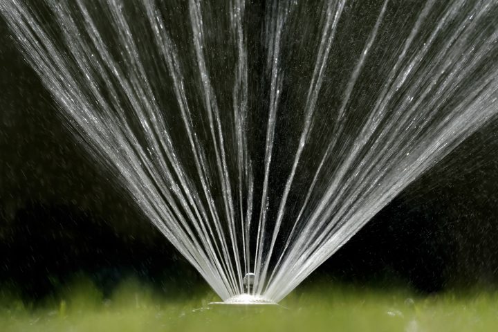Water flies from a sprinkler in this file photo.