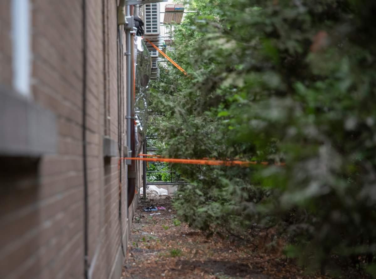 The back area of a motel in Montreal’s St-Laurent borough where there was a shooting involving a police tactical unit is shown on Thursday, August 4, 2022.