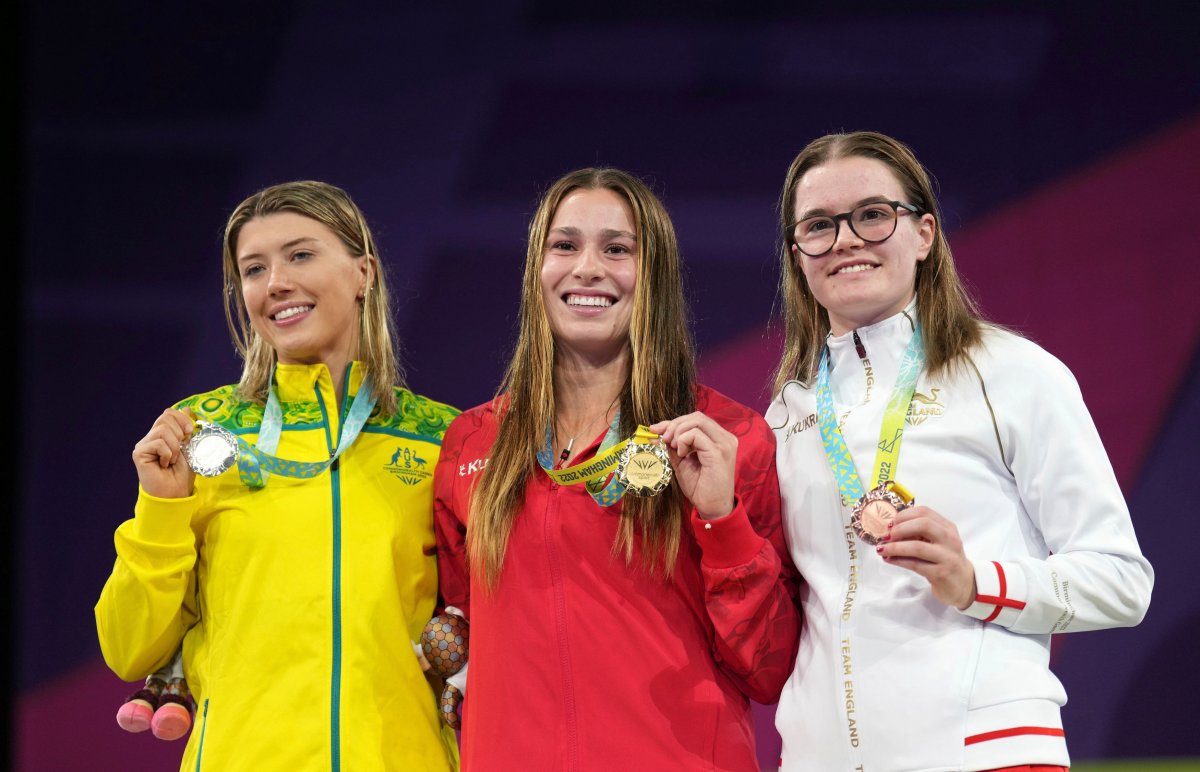 Canada's Mia Vallee with her Gold medal, center, Australia's Brittany Mae O'Brien with her Silver Medal, left, and England's Amy Rollinson with her Bronze medal after the Women's 1m Springboard Final during the Commonwealth Games at the Sandwell Aquatics Centre, Birmingham, England, Friday Aug. 5, 2022.