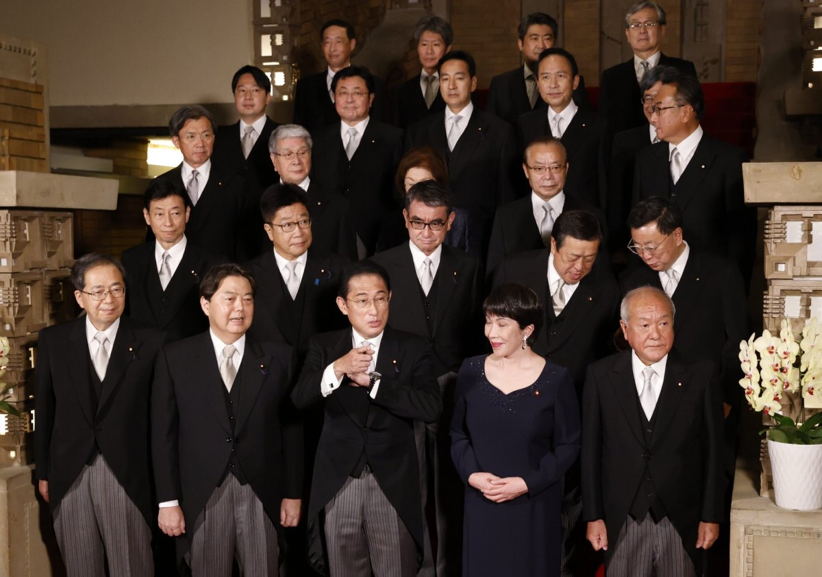 Japan’s Prime Minister Fumio Kishida, front center, and his cabinet ministers attend a photo session at Kishida’s residence Wednesday, Aug. 10, 2022, in Tokyo. (Issei Kato/Pool Photo via AP)