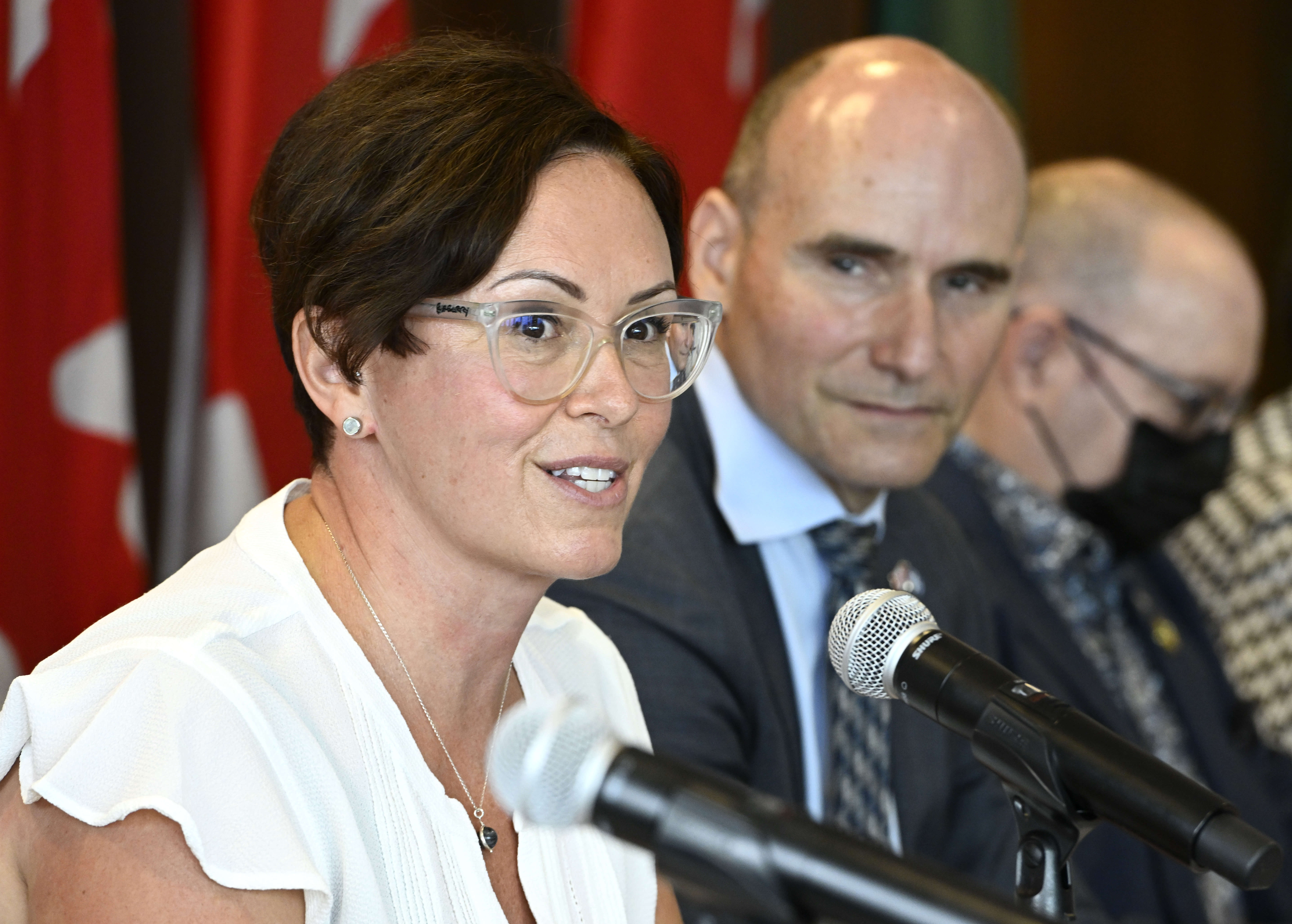 Dr. Leigh Chapman, Canada's Chief Nursing Officer, speaks as Minister of Health Jean-Yves Duclos listens, during a news conference in Ottawa, on Tuesday, Aug. 23, 2022.