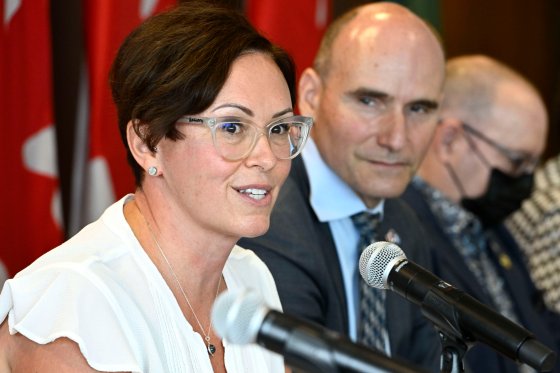 Dr. Leigh Chapman, Canada's Chief Nursing Officer, speaks as Minister of Health Jean-Yves Duclos listens, during a news conference in Ottawa, on Tuesday, Aug. 23, 2022.