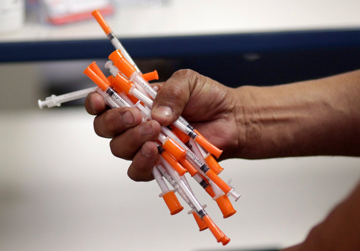 Used needles are shown at a needle exchange in Miami, May 6, 2019.