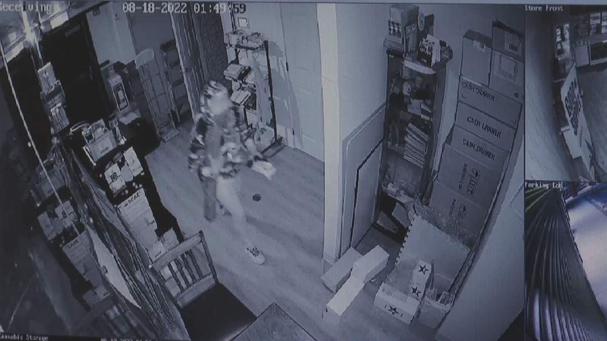 Individuals are seen in Omkara Cannabis after hours, on Aug. 18, 2022.