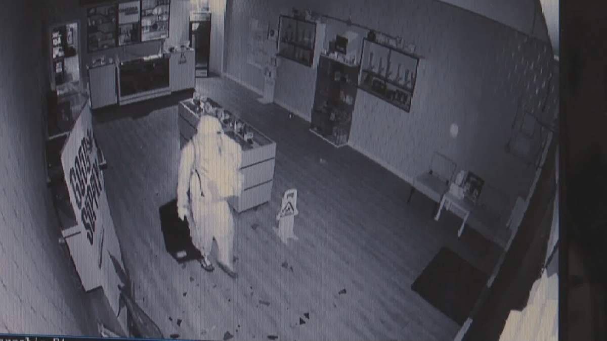 Individuals are seen in Omkara Cannabis after hours, on Aug. 18, 2022.