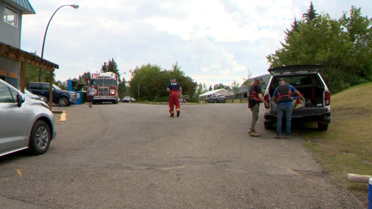 Calgary Fire Department hazardous materials team is pictured at the Glenmore Reservoir on Aug. 25, 2022, following reports of a hydrocarbon spill.
