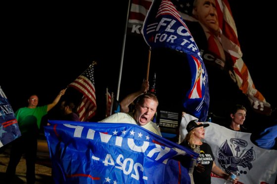 Supporters of former President Donald Trump rally near his home at Mar-A-Lago on August 8, 2022 in Palm Beach, Florida.