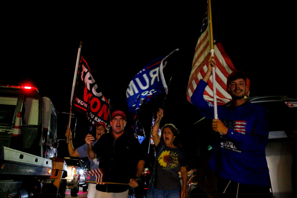 Supporters of former President Donald Trump rally near his home at Mar-A-Lago on August 8, 2022 in Palm Beach, Florida.