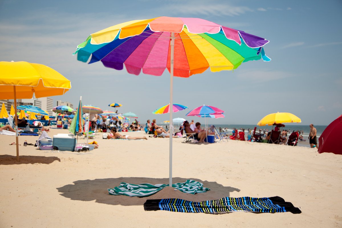 A colorful beach umbrella in the sun