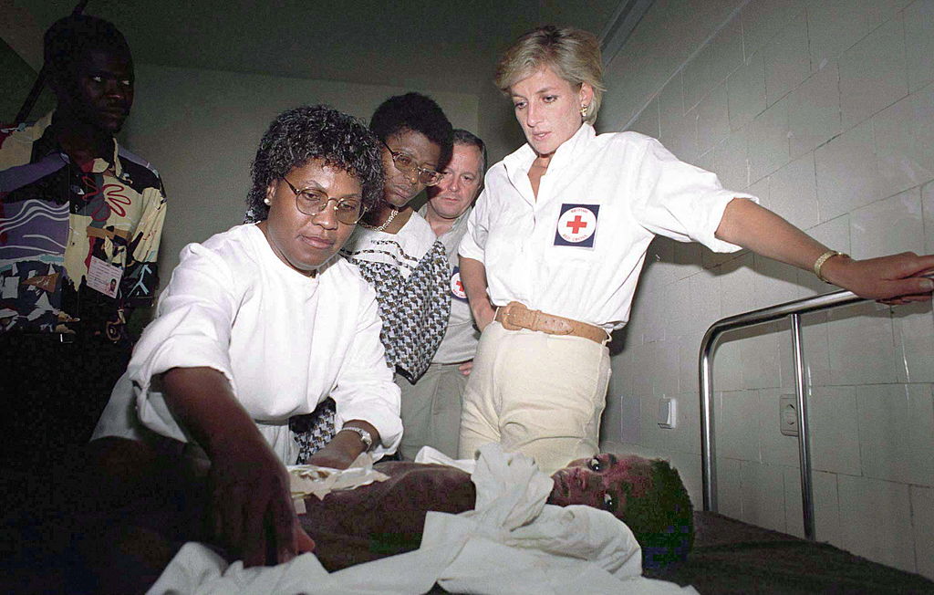 Diana, Princess Of Wales, with seven-year-old Helena Ussoua who lost most of her intestines in a landmine blast.