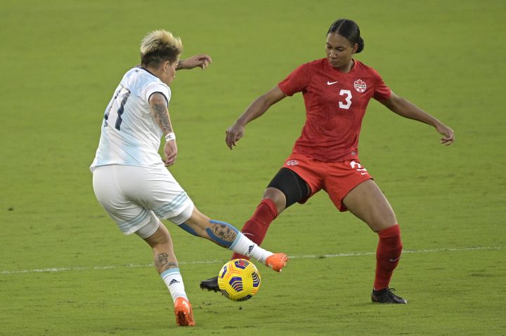Argentina forward Yamila Rodriguez (11) and Canada defender Jade Rose (3) compete for a ball during the first half of a SheBelieves Cup women's soccer match, Sunday, Feb. 21, 2021, in Orlando, Fla. 