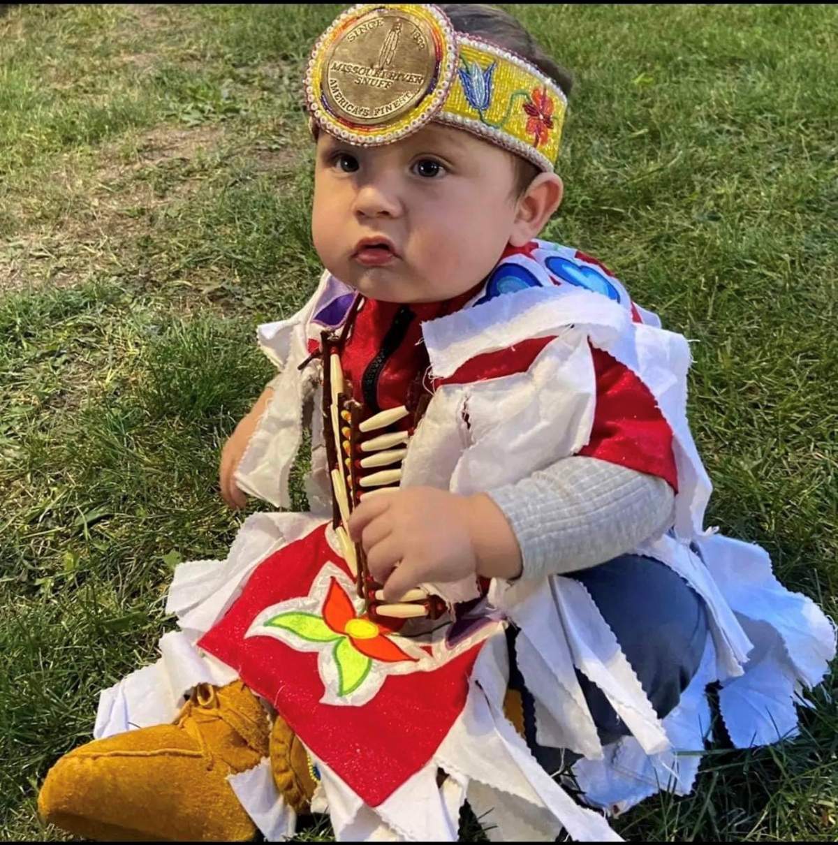 Lakeyn can been seen before the powwow, as he gets ready to dance with his family.