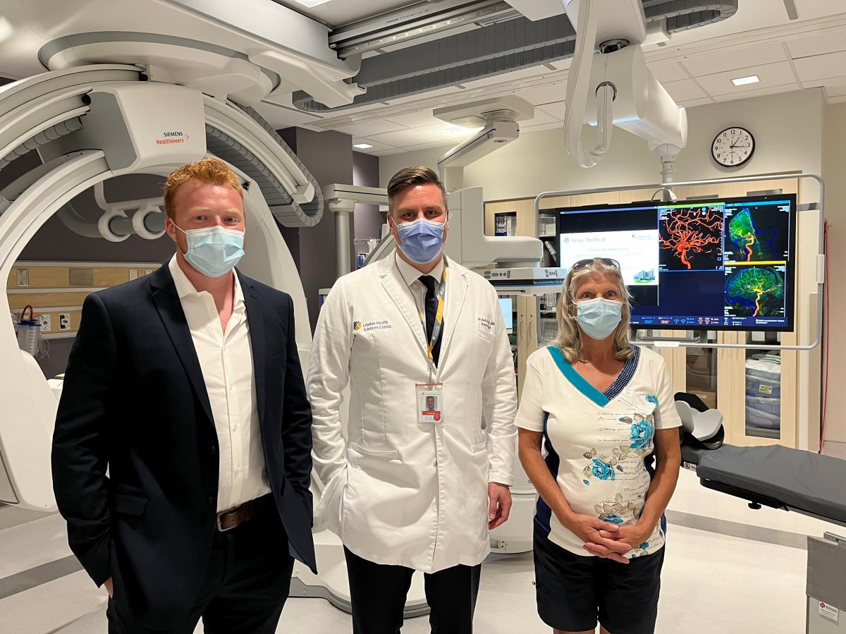 From left to right: Vena Medical co-founder Michael Phillips is joined by Dr. Michael Mayich and patient Wilene Leyen inside the room where the world's first mechanical thrombectomy involving a balloon distal access catheter was performed.