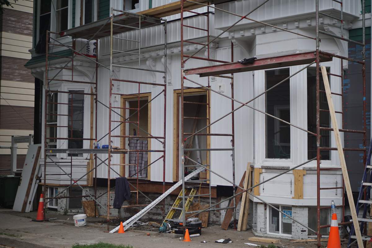 The front stairs of Gomez’s apartment building have been removed.