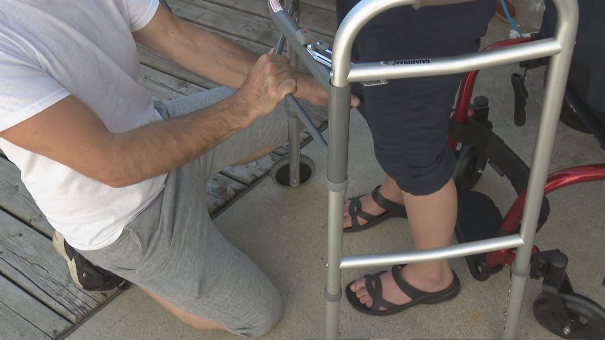 Megan Gallagher, pictured standing with the help of a walker on August 16, 2022, recounts the past four months after a plane crash killed the only other person in the plane near Springbank Airport.