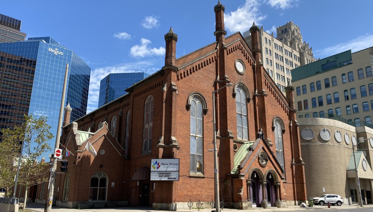A brown-brick church with old fashioned architecture, which stands at the corner of Main and MacNab Streets in downtown Hamilton.