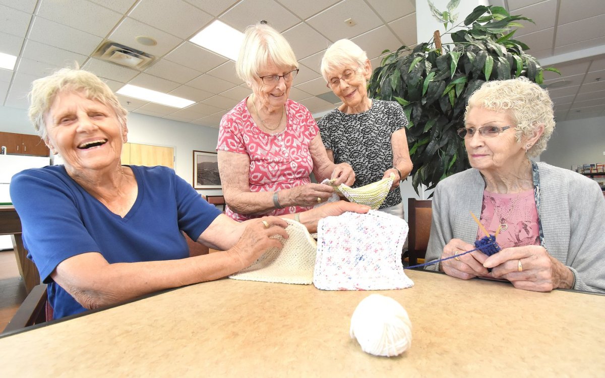 Margaret Anderson, left, of The Hamlets Penticton has a laugh with fellow residents, from left, Jean Grainger, Hannelore Lubben and Wilma Hornby. The women recently created some special blankets they donated.