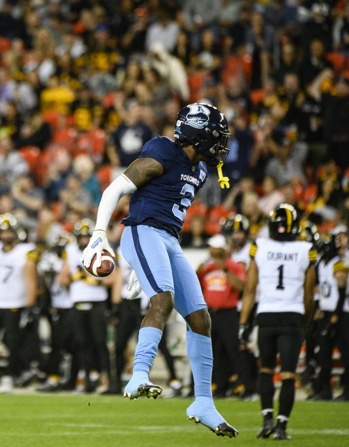 Toronto Argonauts defensive back Jamal Peters (3) celebrates after scoring a touchdown by intercepting a pass by Hamilton Tiger-Cats quarterback Dane Evans (9), during second half CFL football action in Toronto, on Friday, August 26, 2022.