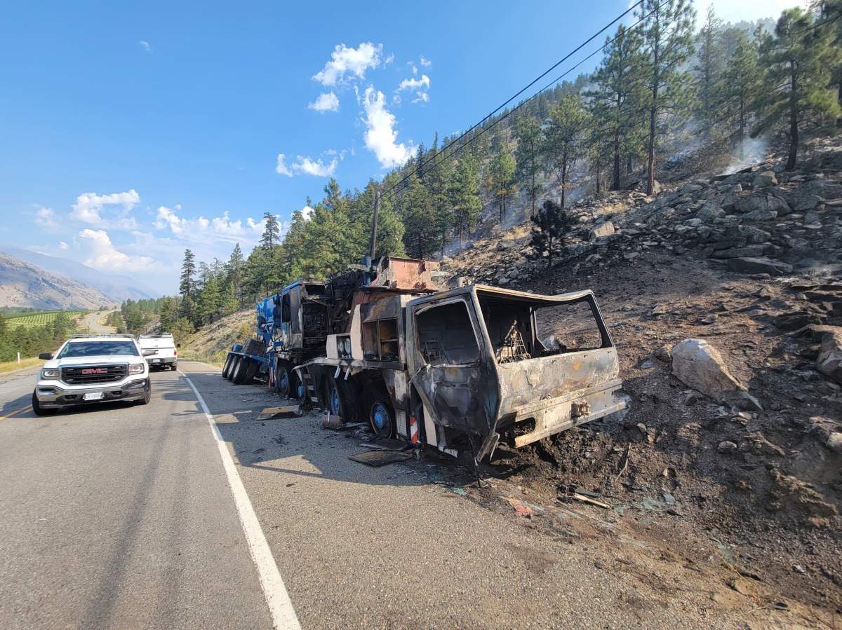 A burned-out vehicle is shown after an accident that sparked a wildfire on Highway 3 west of Osoyoos near Richter Mountain in this photo.